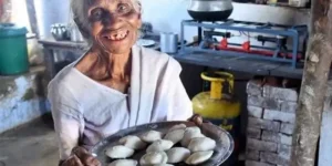 “Idli Amma at 90 serving food with a smile, symbolizing healthy ageing, vibrant living, and compassion.”