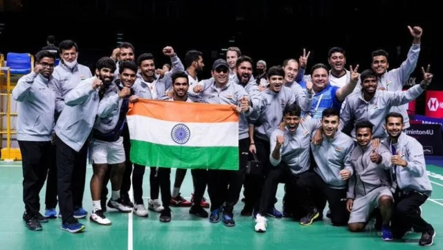 “Indian badminton players celebrating a major victory on court.”
